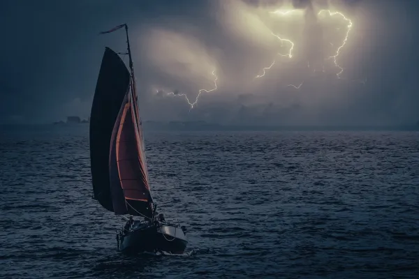 sailboat with Lightening in the sky